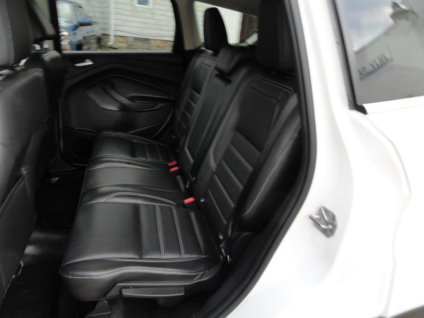 2017 White Titanium /Jet Black Ford Escape Titanium 4WD (1FMCU9JD7HU) with an 1.5L L4 DOHC 16V engine, 6-Speed Automatic transmission, located at 827 W 26th Street, Erie, PA, 16508, (814) 455-3401, 42.105431, -80.090942 - Thanks for looking at our one owner accident and rust-free new arrival. This is the top-of-the-line Titanium model with four-wheel drive, dual power heated leather front seats, remote start, back up camera, push button start, lane departure. blind spot monitor and lots more including two sets of fac - Photo#31