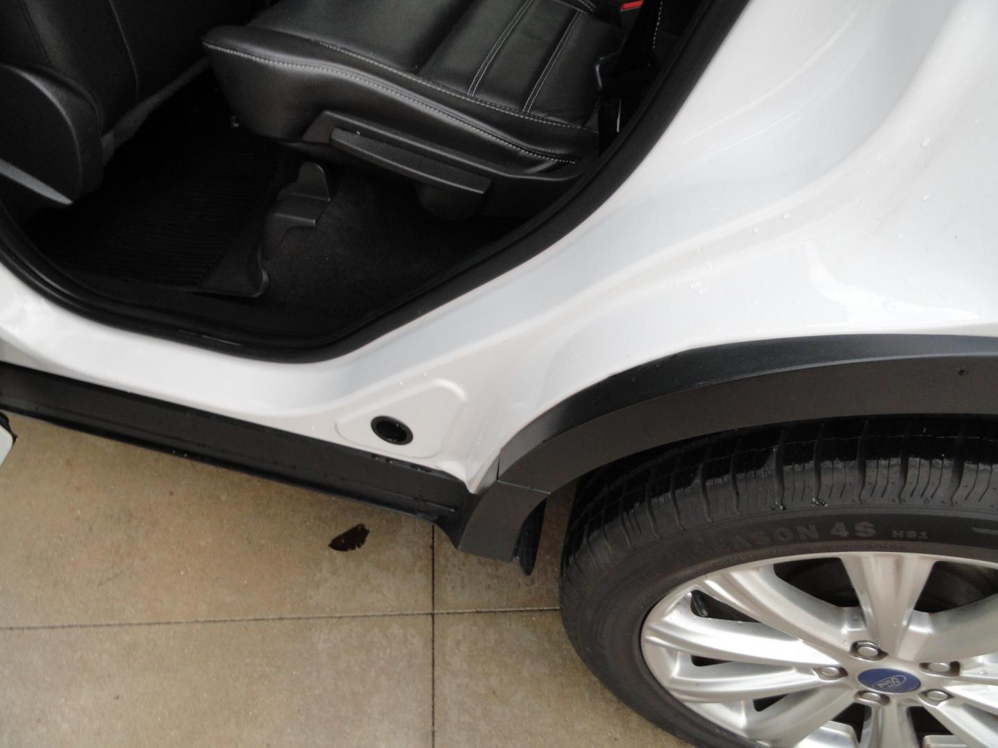 2017 White Titanium /Jet Black Ford Escape Titanium 4WD (1FMCU9JD7HU) with an 1.5L L4 DOHC 16V engine, 6-Speed Automatic transmission, located at 827 W 26th Street, Erie, PA, 16508, (814) 455-3401, 42.105431, -80.090942 - Thanks for looking at our one owner accident and rust-free new arrival. This is the top-of-the-line Titanium model with four-wheel drive, dual power heated leather front seats, remote start, back up camera, push button start, lane departure. blind spot monitor and lots more including two sets of fac - Photo#32