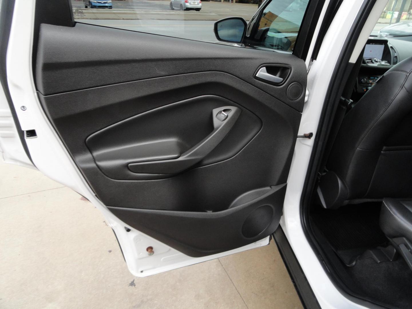 2017 White Titanium /Jet Black Ford Escape Titanium 4WD (1FMCU9JD7HU) with an 1.5L L4 DOHC 16V engine, 6-Speed Automatic transmission, located at 827 W 26th Street, Erie, PA, 16508, (814) 455-3401, 42.105431, -80.090942 - Thanks for looking at our one owner accident and rust-free new arrival. This is the top-of-the-line Titanium model with four-wheel drive, dual power heated leather front seats, remote start, back up camera, push button start, lane departure. blind spot monitor and lots more including two sets of fac - Photo#33