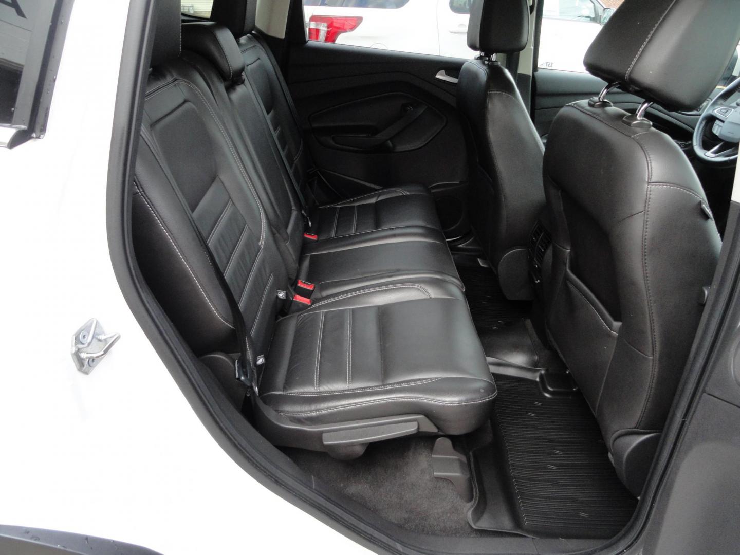 2017 White Titanium /Jet Black Ford Escape Titanium 4WD (1FMCU9JD7HU) with an 1.5L L4 DOHC 16V engine, 6-Speed Automatic transmission, located at 827 W 26th Street, Erie, PA, 16508, (814) 455-3401, 42.105431, -80.090942 - Thanks for looking at our one owner accident and rust-free new arrival. This is the top-of-the-line Titanium model with four-wheel drive, dual power heated leather front seats, remote start, back up camera, push button start, lane departure. blind spot monitor and lots more including two sets of fac - Photo#39