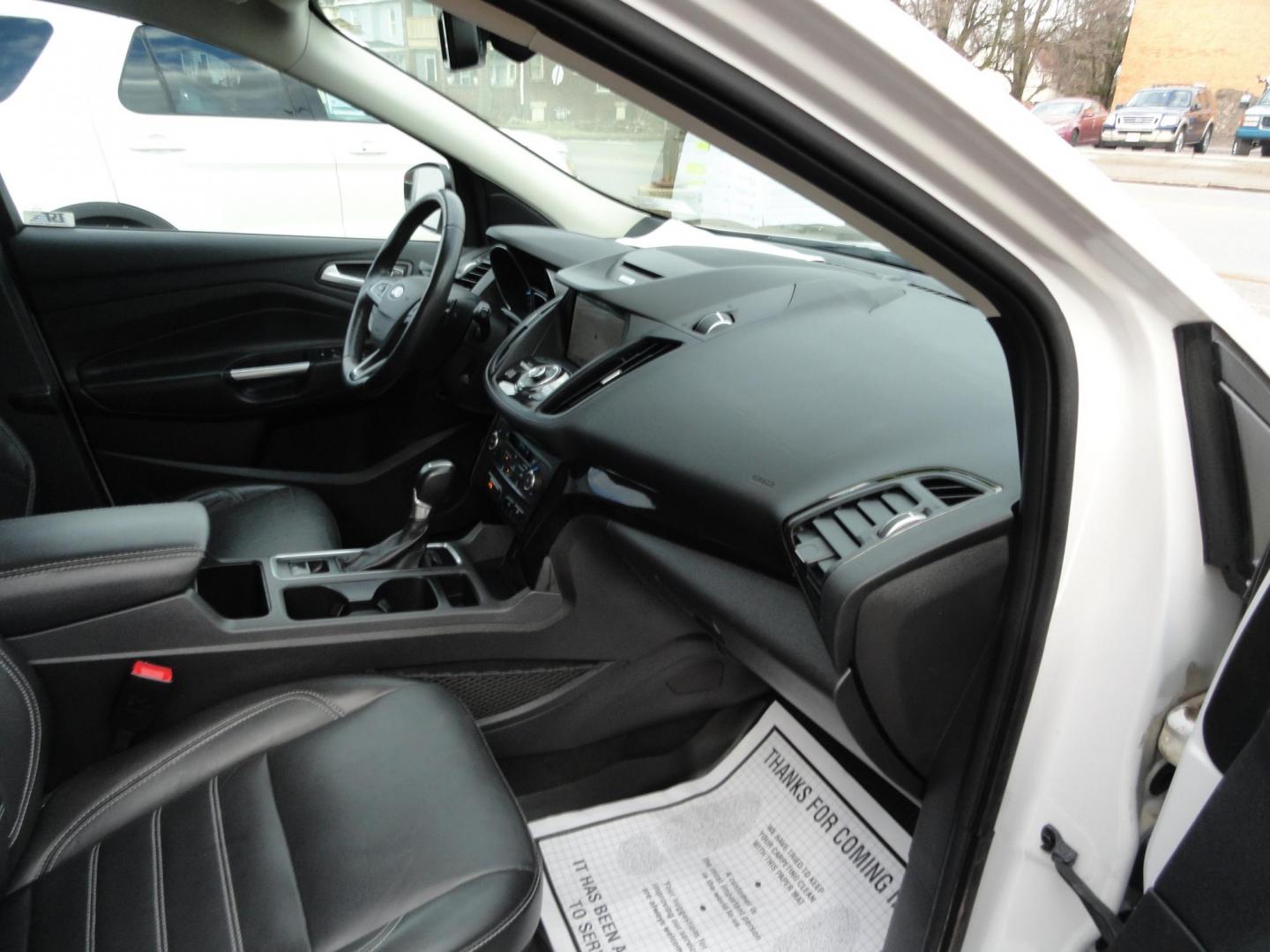 2017 White Titanium /Jet Black Ford Escape Titanium 4WD (1FMCU9JD7HU) with an 1.5L L4 DOHC 16V engine, 6-Speed Automatic transmission, located at 827 W 26th Street, Erie, PA, 16508, (814) 455-3401, 42.105431, -80.090942 - Thanks for looking at our one owner accident and rust-free new arrival. This is the top-of-the-line Titanium model with four-wheel drive, dual power heated leather front seats, remote start, back up camera, push button start, lane departure. blind spot monitor and lots more including two sets of fac - Photo#43