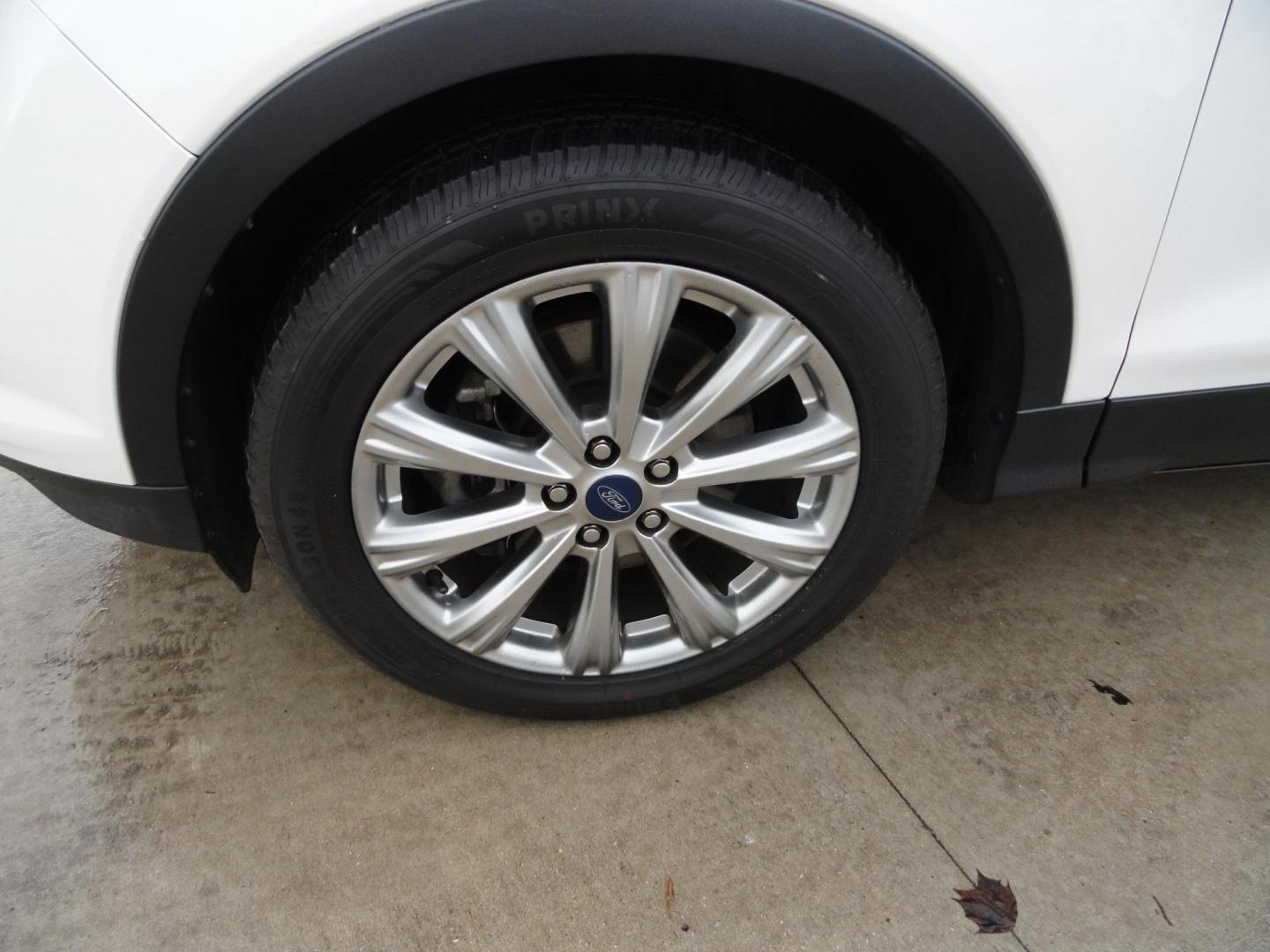 2017 White Titanium /Jet Black Ford Escape Titanium 4WD (1FMCU9JD7HU) with an 1.5L L4 DOHC 16V engine, 6-Speed Automatic transmission, located at 827 W 26th Street, Erie, PA, 16508, (814) 455-3401, 42.105431, -80.090942 - Thanks for looking at our one owner accident and rust-free new arrival. This is the top-of-the-line Titanium model with four-wheel drive, dual power heated leather front seats, remote start, back up camera, push button start, lane departure. blind spot monitor and lots more including two sets of fac - Photo#54