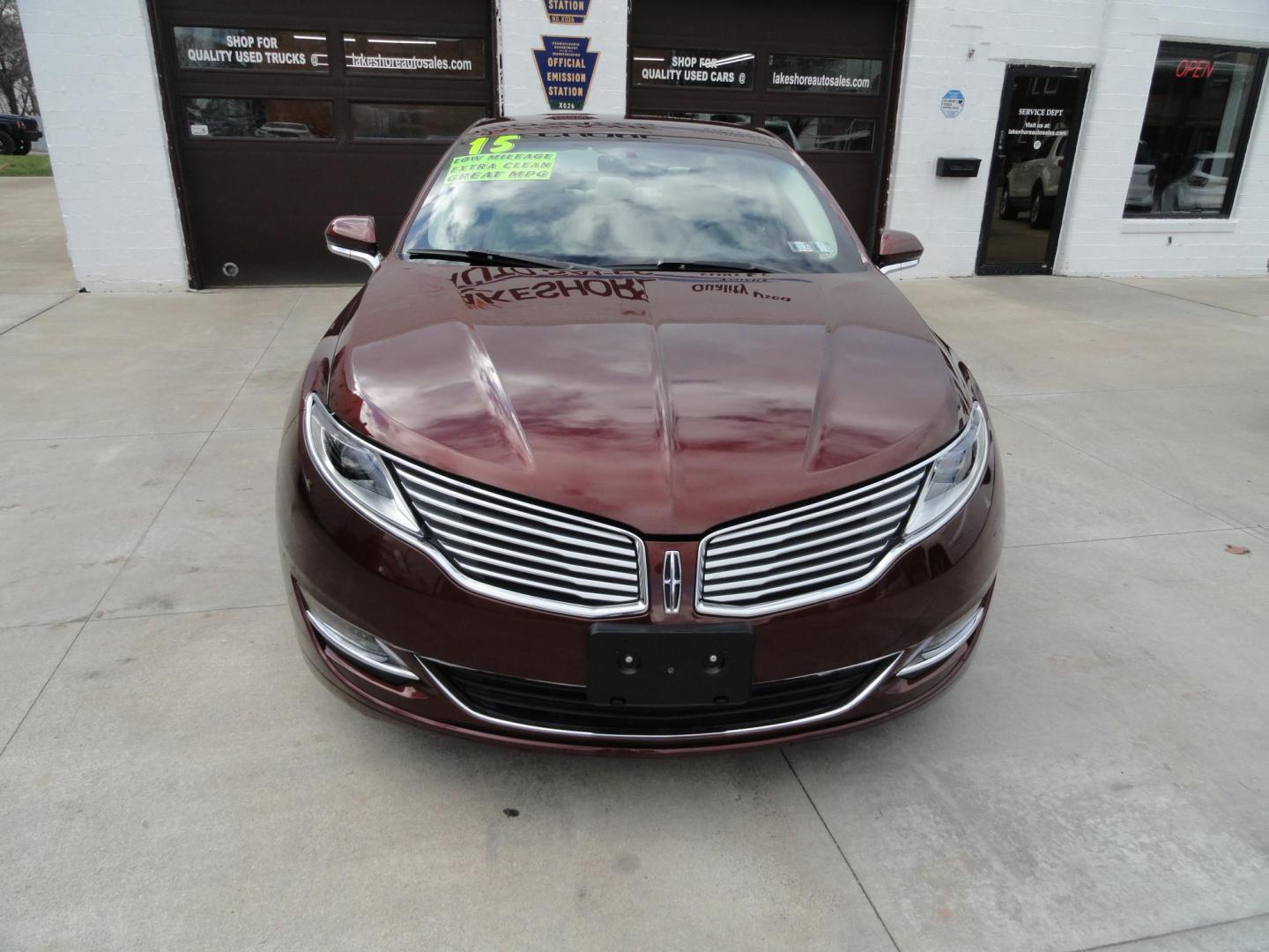 2015 Ruby Red Metallic /Tan Lincoln MKZ Hybrid Sedan (3LN6L2LU5FR) with an 2.0L L4 DOHC 16V HYBRID engine, Continuously Variable Transmission transmission, located at 827 W 26th Street, Erie, PA, 16508, (814) 455-3401, 42.105431, -80.090942 - Thanks for looking at our low mileage great on gas recent trade in. This is the Hybrid edition with lots of options in like new condition with a great exterior as well as a like new interior plus it comes with both keyless remotes, remote start and the factory owner's manuals. A full service was jus - Photo#1