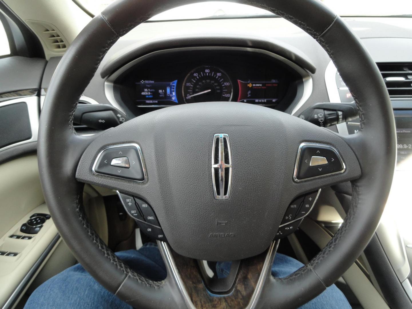 2015 Ruby Red Metallic /Tan Lincoln MKZ Hybrid Sedan (3LN6L2LU5FR) with an 2.0L L4 DOHC 16V HYBRID engine, Continuously Variable Transmission transmission, located at 827 W 26th Street, Erie, PA, 16508, (814) 455-3401, 42.105431, -80.090942 - Thanks for looking at our low mileage great on gas recent trade in. This is the Hybrid edition with lots of options in like new condition with a great exterior as well as a like new interior plus it comes with both keyless remotes, remote start and the factory owner's manuals. A full service was jus - Photo#10