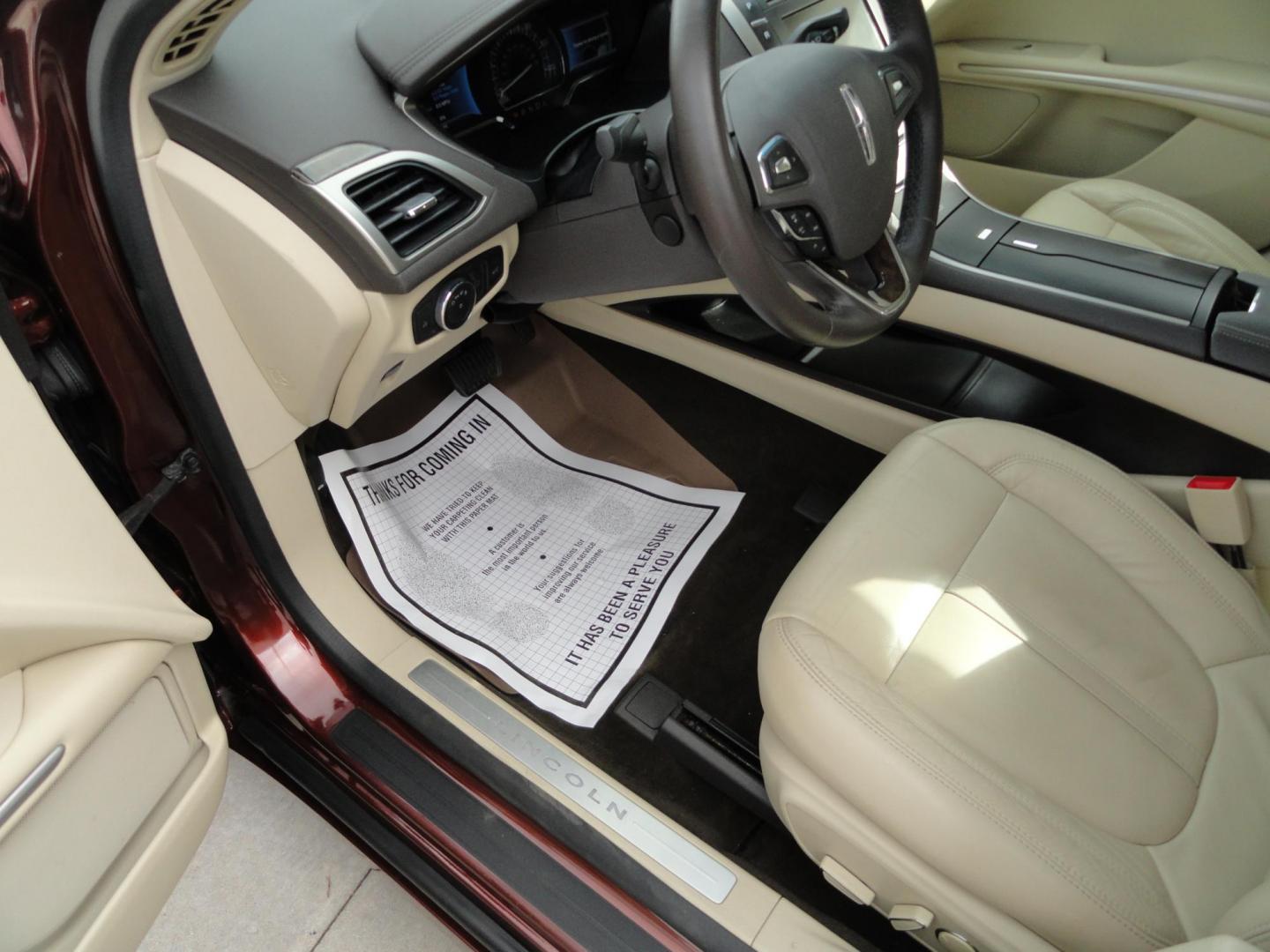 2015 Ruby Red Metallic /Tan Lincoln MKZ Hybrid Sedan (3LN6L2LU5FR) with an 2.0L L4 DOHC 16V HYBRID engine, Continuously Variable Transmission transmission, located at 827 W 26th Street, Erie, PA, 16508, (814) 455-3401, 42.105431, -80.090942 - Thanks for looking at our low mileage great on gas recent trade in. This is the Hybrid edition with lots of options in like new condition with a great exterior as well as a like new interior plus it comes with both keyless remotes, remote start and the factory owner's manuals. A full service was jus - Photo#17