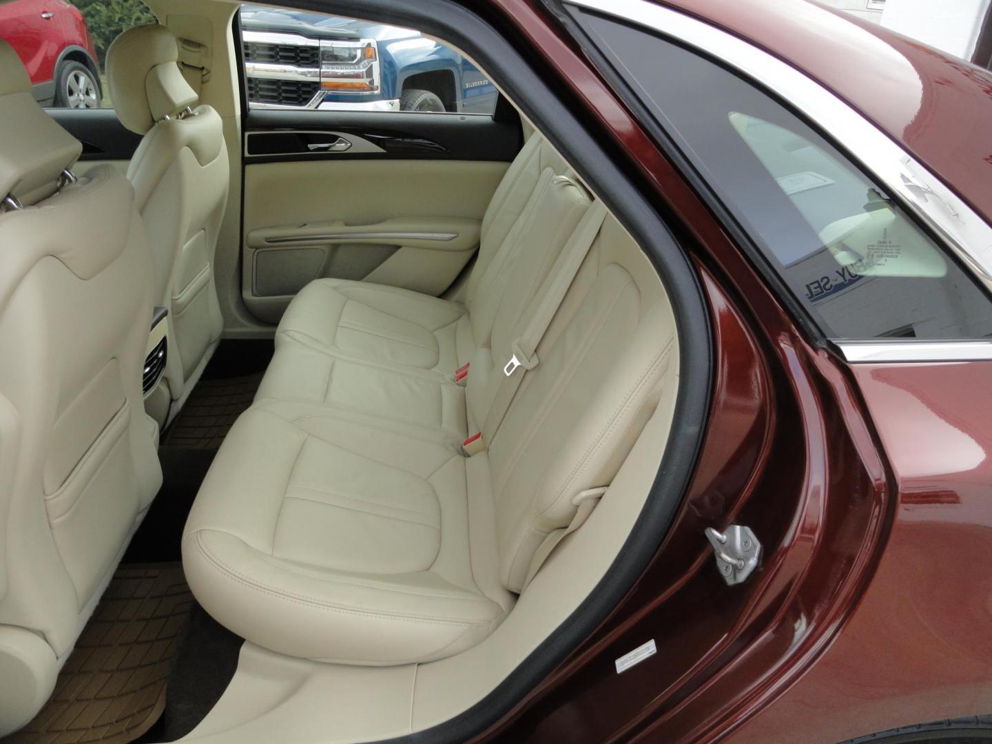 2015 Ruby Red Metallic /Tan Lincoln MKZ Hybrid Sedan (3LN6L2LU5FR) with an 2.0L L4 DOHC 16V HYBRID engine, Continuously Variable Transmission transmission, located at 827 W 26th Street, Erie, PA, 16508, (814) 455-3401, 42.105431, -80.090942 - Thanks for looking at our low mileage great on gas recent trade in. This is the Hybrid edition with lots of options in like new condition with a great exterior as well as a like new interior plus it comes with both keyless remotes, remote start and the factory owner's manuals. A full service was jus - Photo#21