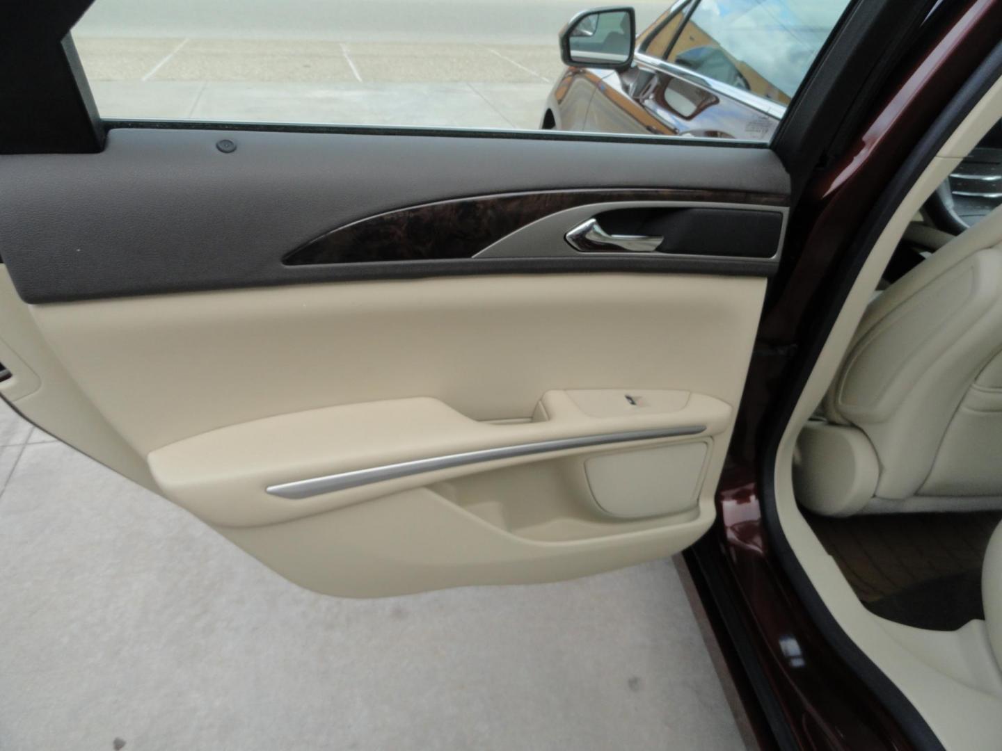 2015 Ruby Red Metallic /Tan Lincoln MKZ Hybrid Sedan (3LN6L2LU5FR) with an 2.0L L4 DOHC 16V HYBRID engine, Continuously Variable Transmission transmission, located at 827 W 26th Street, Erie, PA, 16508, (814) 455-3401, 42.105431, -80.090942 - Thanks for looking at our low mileage great on gas recent trade in. This is the Hybrid edition with lots of options in like new condition with a great exterior as well as a like new interior plus it comes with both keyless remotes, remote start and the factory owner's manuals. A full service was jus - Photo#23