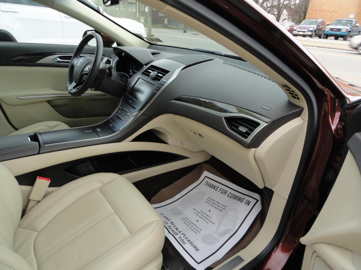 2015 Ruby Red Metallic /Tan Lincoln MKZ Hybrid Sedan (3LN6L2LU5FR) with an 2.0L L4 DOHC 16V HYBRID engine, Continuously Variable Transmission transmission, located at 827 W 26th Street, Erie, PA, 16508, (814) 455-3401, 42.105431, -80.090942 - Thanks for looking at our low mileage great on gas recent trade in. This is the Hybrid edition with lots of options in like new condition with a great exterior as well as a like new interior plus it comes with both keyless remotes, remote start and the factory owner's manuals. A full service was jus - Photo#28