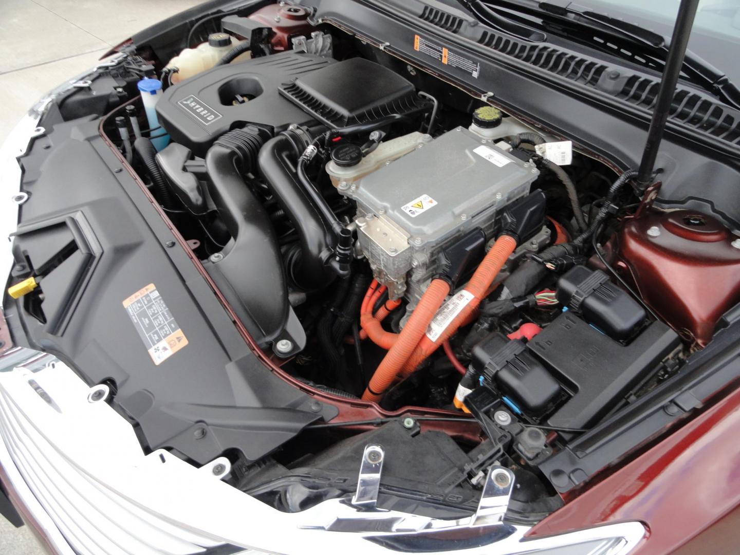 2015 Ruby Red Metallic /Tan Lincoln MKZ Hybrid Sedan (3LN6L2LU5FR) with an 2.0L L4 DOHC 16V HYBRID engine, Continuously Variable Transmission transmission, located at 827 W 26th Street, Erie, PA, 16508, (814) 455-3401, 42.105431, -80.090942 - Thanks for looking at our low mileage great on gas recent trade in. This is the Hybrid edition with lots of options in like new condition with a great exterior as well as a like new interior plus it comes with both keyless remotes, remote start and the factory owner's manuals. A full service was jus - Photo#33