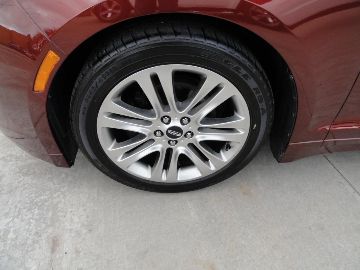 2015 Ruby Red Metallic /Tan Lincoln MKZ Hybrid Sedan (3LN6L2LU5FR) with an 2.0L L4 DOHC 16V HYBRID engine, Continuously Variable Transmission transmission, located at 827 W 26th Street, Erie, PA, 16508, (814) 455-3401, 42.105431, -80.090942 - Thanks for looking at our low mileage great on gas recent trade in. This is the Hybrid edition with lots of options in like new condition with a great exterior as well as a like new interior plus it comes with both keyless remotes, remote start and the factory owner's manuals. A full service was jus - Photo#36