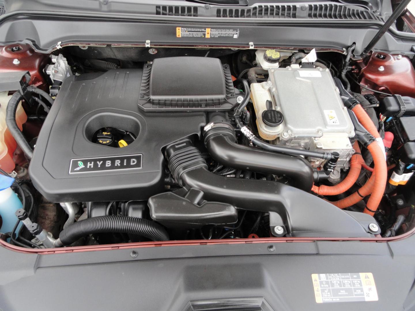 2015 Ruby Red Metallic /Tan Lincoln MKZ Hybrid Sedan (3LN6L2LU5FR) with an 2.0L L4 DOHC 16V HYBRID engine, Continuously Variable Transmission transmission, located at 827 W 26th Street, Erie, PA, 16508, (814) 455-3401, 42.105431, -80.090942 - Thanks for looking at our low mileage great on gas recent trade in. This is the Hybrid edition with lots of options in like new condition with a great exterior as well as a like new interior plus it comes with both keyless remotes, remote start and the factory owner's manuals. A full service was jus - Photo#32