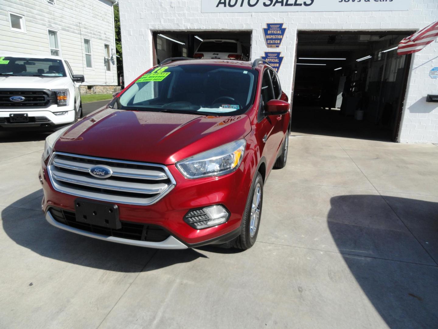 2018 Ruby Red Metallic /Greystone Ford Escape SE 4WD (1FMCU9GD1JU) with an 1.5L L4 DOHC 16V engine, 6A transmission, located at 827 W 26th Street, Erie, PA, 16508, (814) 455-3401, 42.105431, -80.090942 - Thanks for looking at our low mileage accident free one owner new vehicle trade. This is the SE model with all wheel drive, power drivers seat, Bluetooth and lots more including both keys and remotes, the owner's manuals and the original floor mats. A full service was just completed in our service d - Photo#7