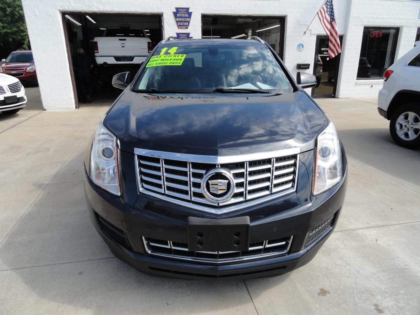 2014 Sapphire Blue Metallic /Jet Black Cadillac SRX Luxury Collection AWD (3GYFNEE35ES) with an 3.6L V6 DOHC 24V FFV engine, 6-Speed Automatic transmission, located at 827 W 26th Street, Erie, PA, 16508, (814) 455-3401, 42.105431, -80.090942 - Thanks for looking at our low mileage ONE OWNER, ACCIDENT AND DAMAGE FREE new arrival. The is the SRX4 all-wheel drive model with lots of options including dual power heated seats, leather seating area, memory drivers seat, panoramic sunroof, remote start, passive entry system, blind spot monitor, b- Photo#1