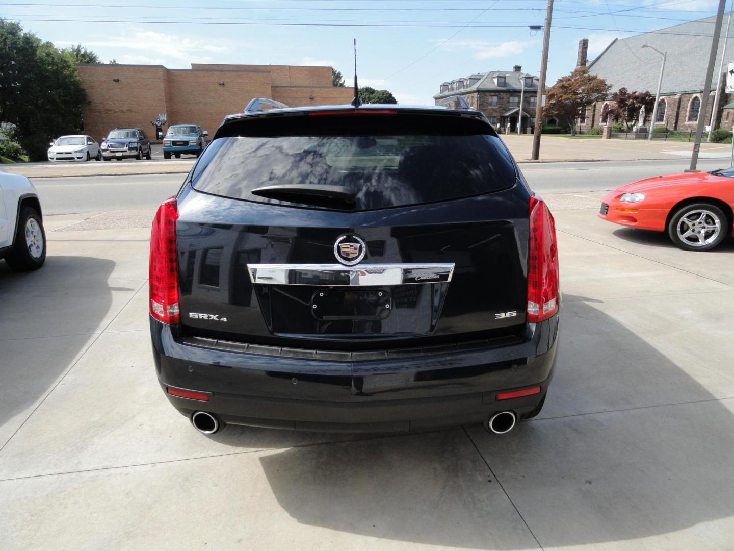 2014 Sapphire Blue Metallic /Jet Black Cadillac SRX Luxury Collection AWD (3GYFNEE35ES) with an 3.6L V6 DOHC 24V FFV engine, 6-Speed Automatic transmission, located at 827 W 26th Street, Erie, PA, 16508, (814) 455-3401, 42.105431, -80.090942 - Thanks for looking at our low mileage ONE OWNER, ACCIDENT AND DAMAGE FREE new arrival. The is the SRX4 all-wheel drive model with lots of options including dual power heated seats, leather seating area, memory drivers seat, panoramic sunroof, remote start, passive entry system, blind spot monitor, b- Photo#4