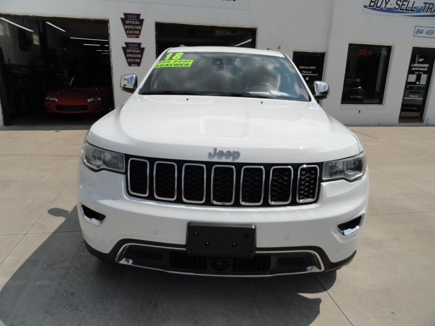 2018 Bright White /Jet Black Jeep Grand Cherokee Limited 4WD (1C4RJFBT2JC) with an 5.7L V8 OHV 16V engine, 8 SPEED AUTOMATIC transmission, located at 827 W 26th Street, Erie, PA, 16508, (814) 455-3401, 42.105431, -80.090942 - Thanks for looking at our two-owner accident and rust-free recent arrival. This is the Limited model with the hard-to-find HEMI 5.7 V-8 engine, four-wheel drive, dual power heated front seats, leather seating areas, back up camera, navigation, power sunroof, power lift gate, remote start, keyless en- Photo#1