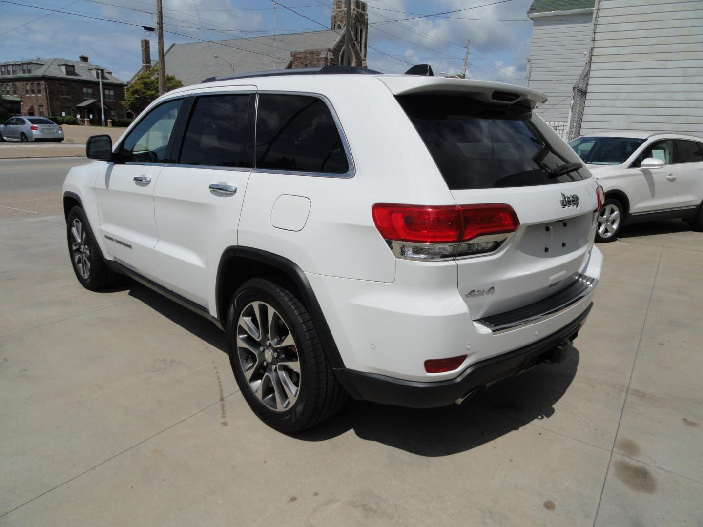 2018 Bright White /Jet Black Jeep Grand Cherokee Limited 4WD (1C4RJFBT2JC) with an 5.7L V8 OHV 16V engine, 8 SPEED AUTOMATIC transmission, located at 827 W 26th Street, Erie, PA, 16508, (814) 455-3401, 42.105431, -80.090942 - Thanks for looking at our two-owner accident and rust-free recent arrival. This is the Limited model with the hard-to-find HEMI 5.7 V-8 engine, four-wheel drive, dual power heated front seats, leather seating areas, back up camera, navigation, power sunroof, power lift gate, remote start, keyless en- Photo#5