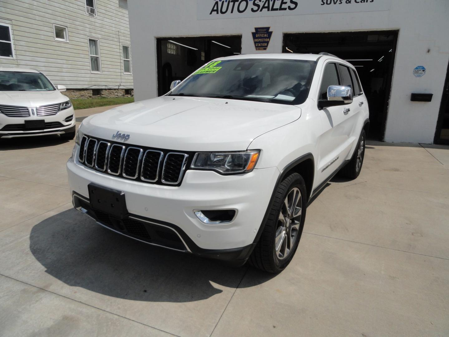 2018 Bright White /Jet Black Jeep Grand Cherokee Limited 4WD (1C4RJFBT2JC) with an 5.7L V8 OHV 16V engine, 8 SPEED AUTOMATIC transmission, located at 827 W 26th Street, Erie, PA, 16508, (814) 455-3401, 42.105431, -80.090942 - Thanks for looking at our two-owner accident and rust-free recent arrival. This is the Limited model with the hard-to-find HEMI 5.7 V-8 engine, four-wheel drive, dual power heated front seats, leather seating areas, back up camera, navigation, power sunroof, power lift gate, remote start, keyless en- Photo#7