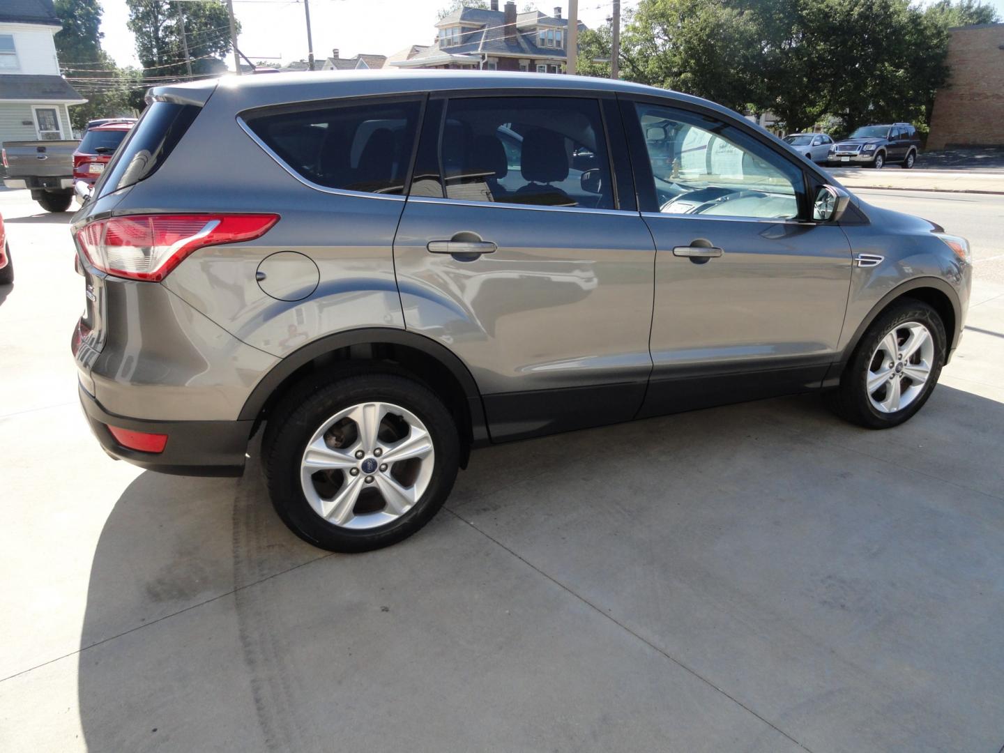 2014 Sterling Gray Metallic /Greystone Ford Escape SE 4WD (1FMCU9GX6EU) with an 1.6L L4 DOHC 16V engine, 6-Speed Automatic transmission, located at 827 W 26th Street, Erie, PA, 16508, (814) 455-3401, 42.105431, -80.090942 - Thanks for looking at our low mileage one owner accident-free recent arrival. This is the SE model with four-wheel drive, power seat, back up camera, Bluetooth, both keys and remotes, the owner's manuals and the factory floor mats. A complete service was just done in our service department and it's- Photo#3
