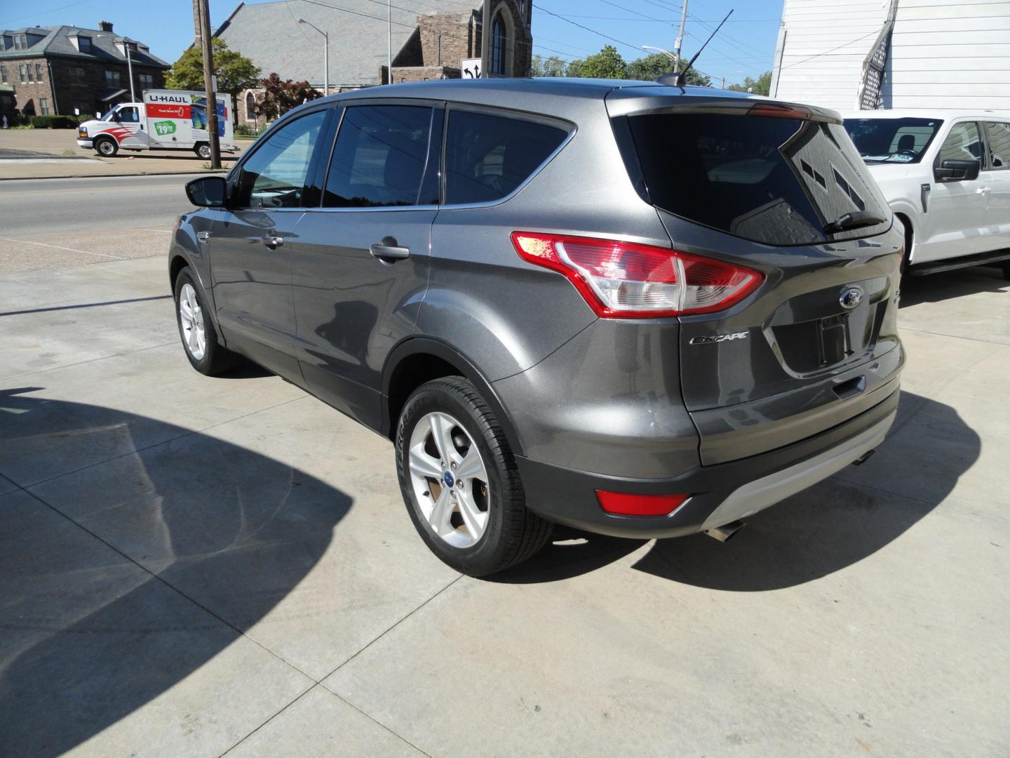 2014 Sterling Gray Metallic /Greystone Ford Escape SE 4WD (1FMCU9GX6EU) with an 1.6L L4 DOHC 16V engine, 6-Speed Automatic transmission, located at 827 W 26th Street, Erie, PA, 16508, (814) 455-3401, 42.105431, -80.090942 - Thanks for looking at our low mileage one owner accident-free recent arrival. This is the SE model with four-wheel drive, power seat, back up camera, Bluetooth, both keys and remotes, the owner's manuals and the factory floor mats. A complete service was just done in our service department and it's- Photo#5