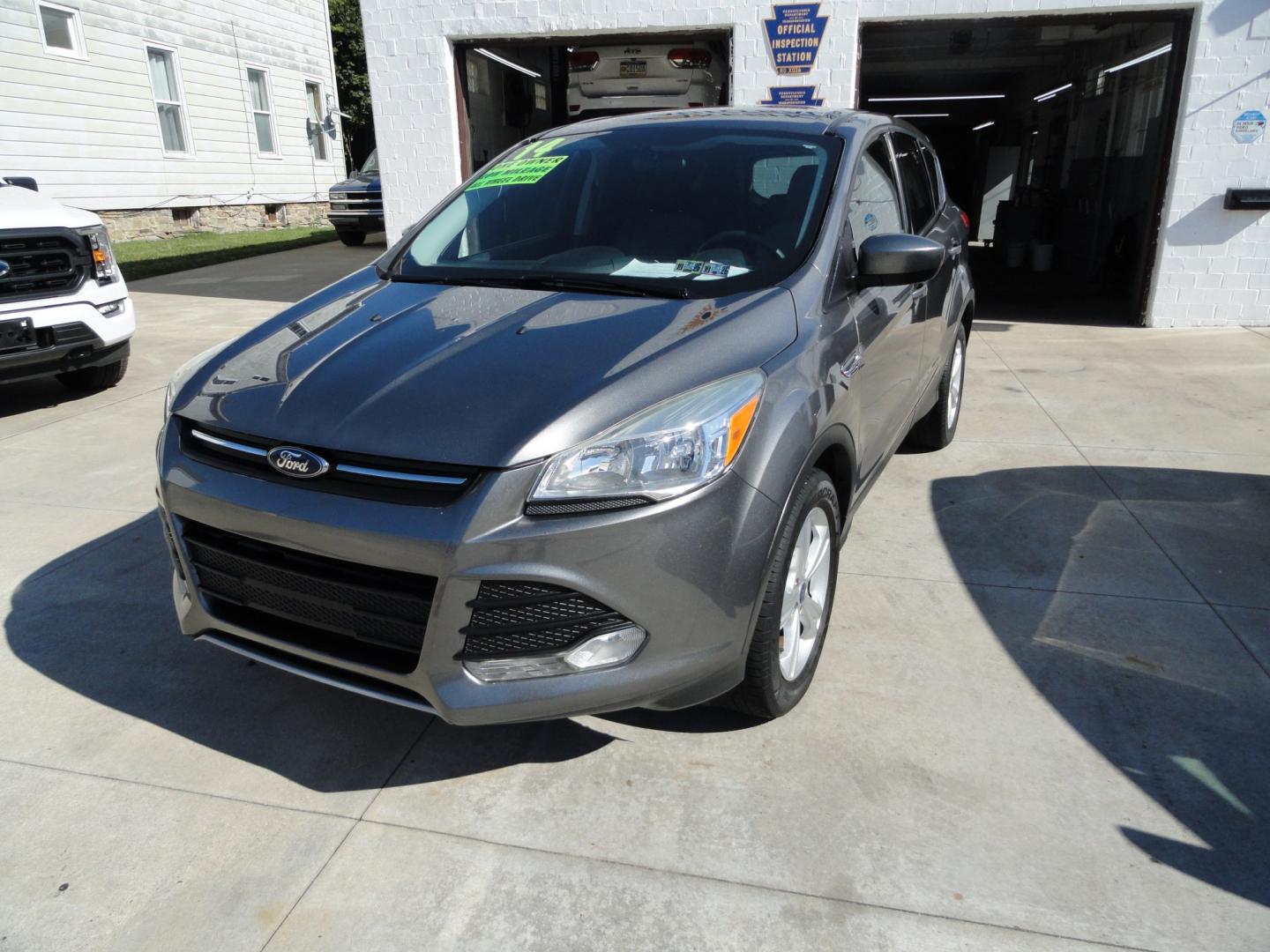 2014 Sterling Gray Metallic /Greystone Ford Escape SE 4WD (1FMCU9GX6EU) with an 1.6L L4 DOHC 16V engine, 6-Speed Automatic transmission, located at 827 W 26th Street, Erie, PA, 16508, (814) 455-3401, 42.105431, -80.090942 - Thanks for looking at our low mileage one owner accident-free recent arrival. This is the SE model with four-wheel drive, power seat, back up camera, Bluetooth, both keys and remotes, the owner's manuals and the factory floor mats. A complete service was just done in our service department and it's- Photo#7