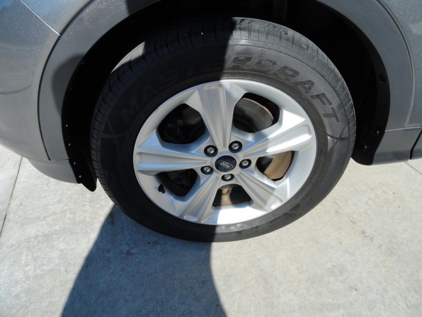 2014 Sterling Gray Metallic /Greystone Ford Escape SE 4WD (1FMCU9GX6EU) with an 1.6L L4 DOHC 16V engine, 6-Speed Automatic transmission, located at 827 W 26th Street, Erie, PA, 16508, (814) 455-3401, 42.105431, -80.090942 - Thanks for looking at our low mileage one owner accident-free recent arrival. This is the SE model with four-wheel drive, power seat, back up camera, Bluetooth, both keys and remotes, the owner's manuals and the factory floor mats. A complete service was just done in our service department and it's- Photo#42