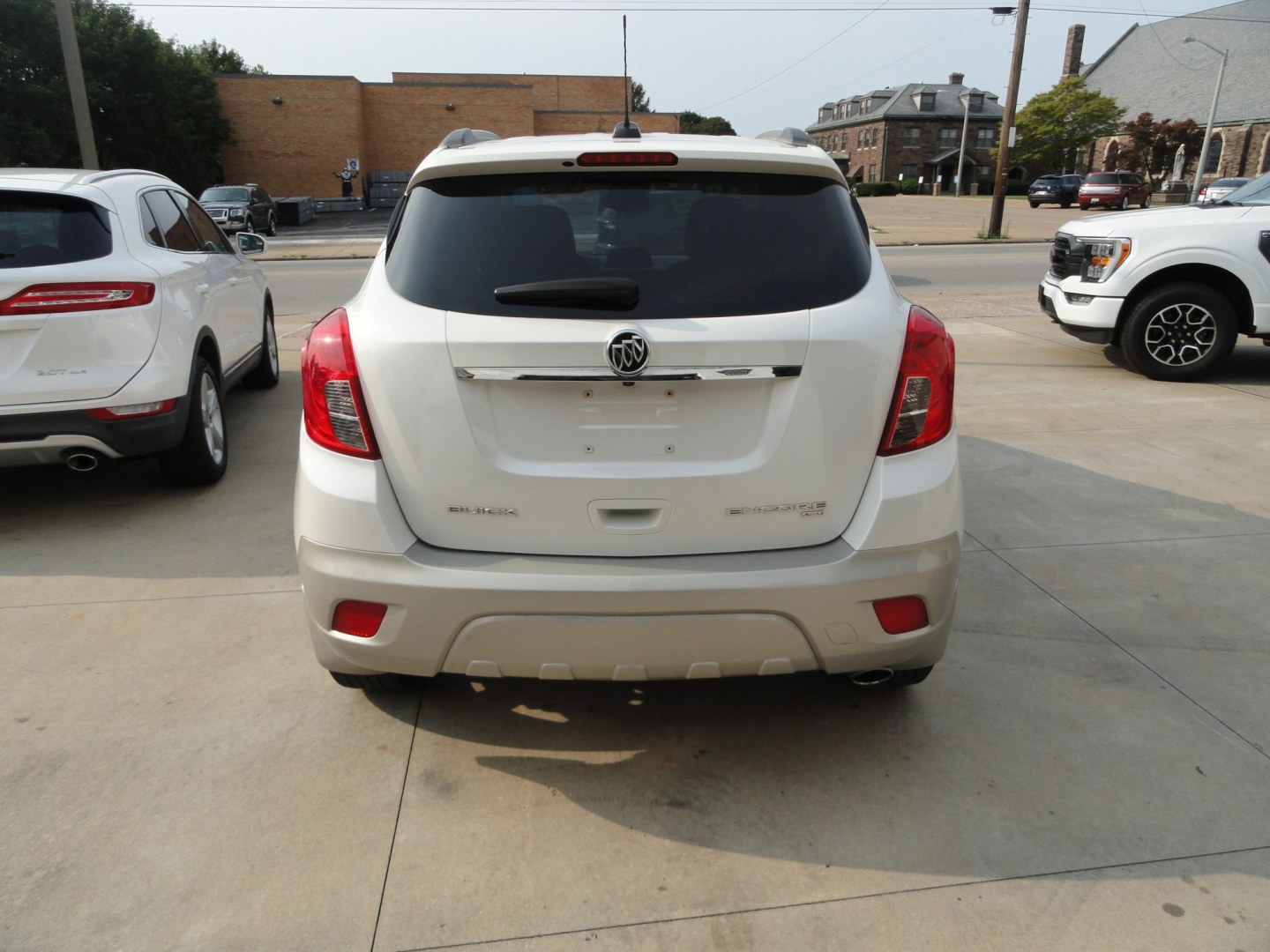 2016 While Pearl Tricoat /Titanium Buick Encore Convenience AWD (KL4CJFSB8GB) with an 1.4L L4 DOHC 16V TURBO engine, 6-Speed Automatic transmission, located at 827 W 26th Street, Erie, PA, 16508, (814) 455-3401, 42.105431, -80.090942- Photo#4