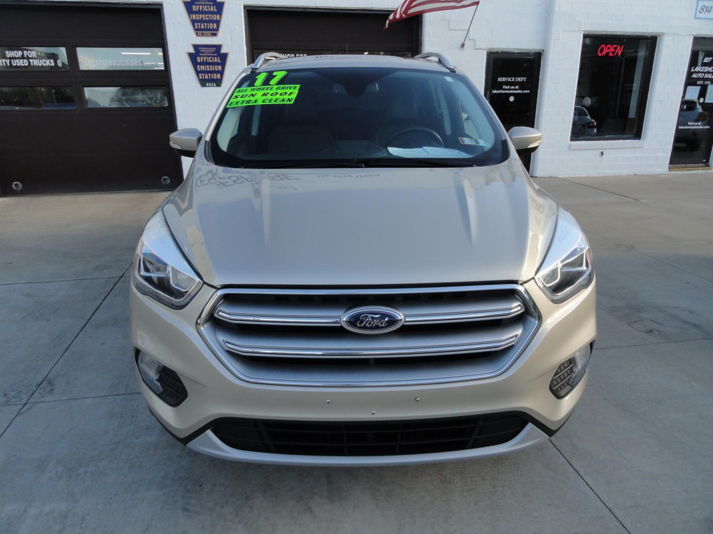 2017 White Gold Metallic /Black Ford Escape Titanium 4WD (1FMCU9J97HU) with an 2.0L L4 DOHC 16V engine, 6-Speed Automatic transmission, located at 827 W 26th Street, Erie, PA, 16508, (814) 455-3401, 42.105431, -80.090942 - Thanks for looking at our extra clean accident and rust free two owner recent arrival. This is the top-of-the-line Titanium four-wheel drive model that's in like new condition with no paint or body damage and the nonsmoker interior is like new also, plus it comes with all the options available inclu- Photo#1