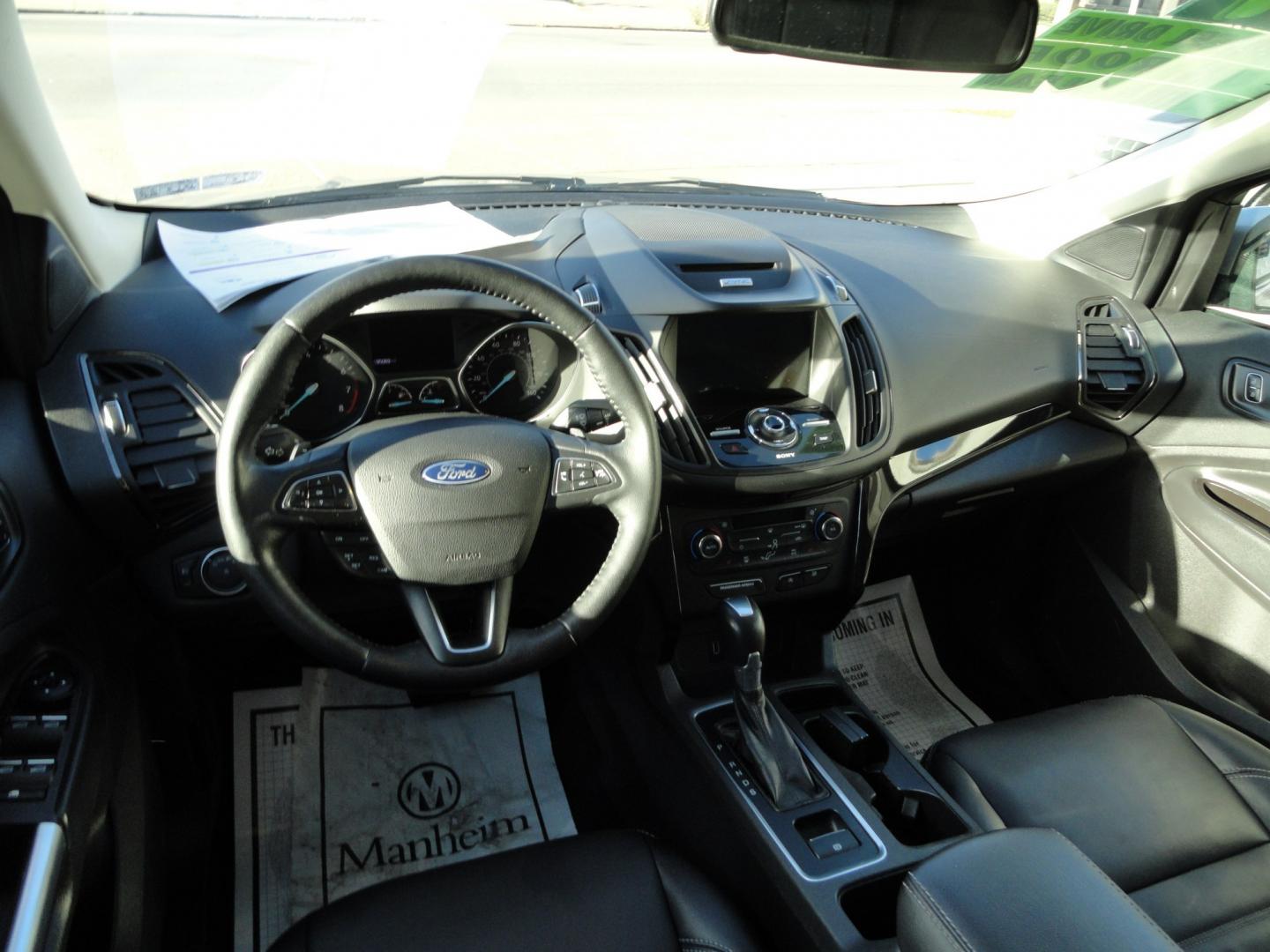 2017 White Gold Metallic /Black Ford Escape Titanium 4WD (1FMCU9J97HU) with an 2.0L L4 DOHC 16V engine, 6-Speed Automatic transmission, located at 827 W 26th Street, Erie, PA, 16508, (814) 455-3401, 42.105431, -80.090942 - Thanks for looking at our extra clean accident and rust free two owner recent arrival. This is the top-of-the-line Titanium four-wheel drive model that's in like new condition with no paint or body damage and the nonsmoker interior is like new also, plus it comes with all the options available inclu- Photo#8
