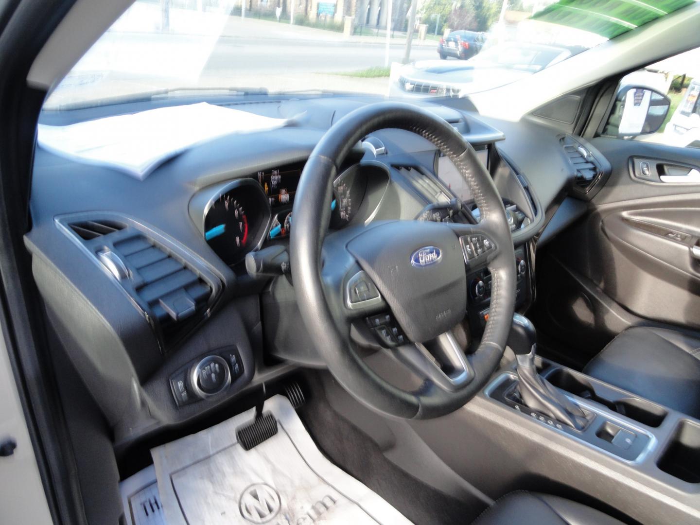 2017 White Gold Metallic /Black Ford Escape Titanium 4WD (1FMCU9J97HU) with an 2.0L L4 DOHC 16V engine, 6-Speed Automatic transmission, located at 827 W 26th Street, Erie, PA, 16508, (814) 455-3401, 42.105431, -80.090942 - Thanks for looking at our extra clean accident and rust free two owner recent arrival. This is the top-of-the-line Titanium four-wheel drive model that's in like new condition with no paint or body damage and the nonsmoker interior is like new also, plus it comes with all the options available inclu- Photo#21