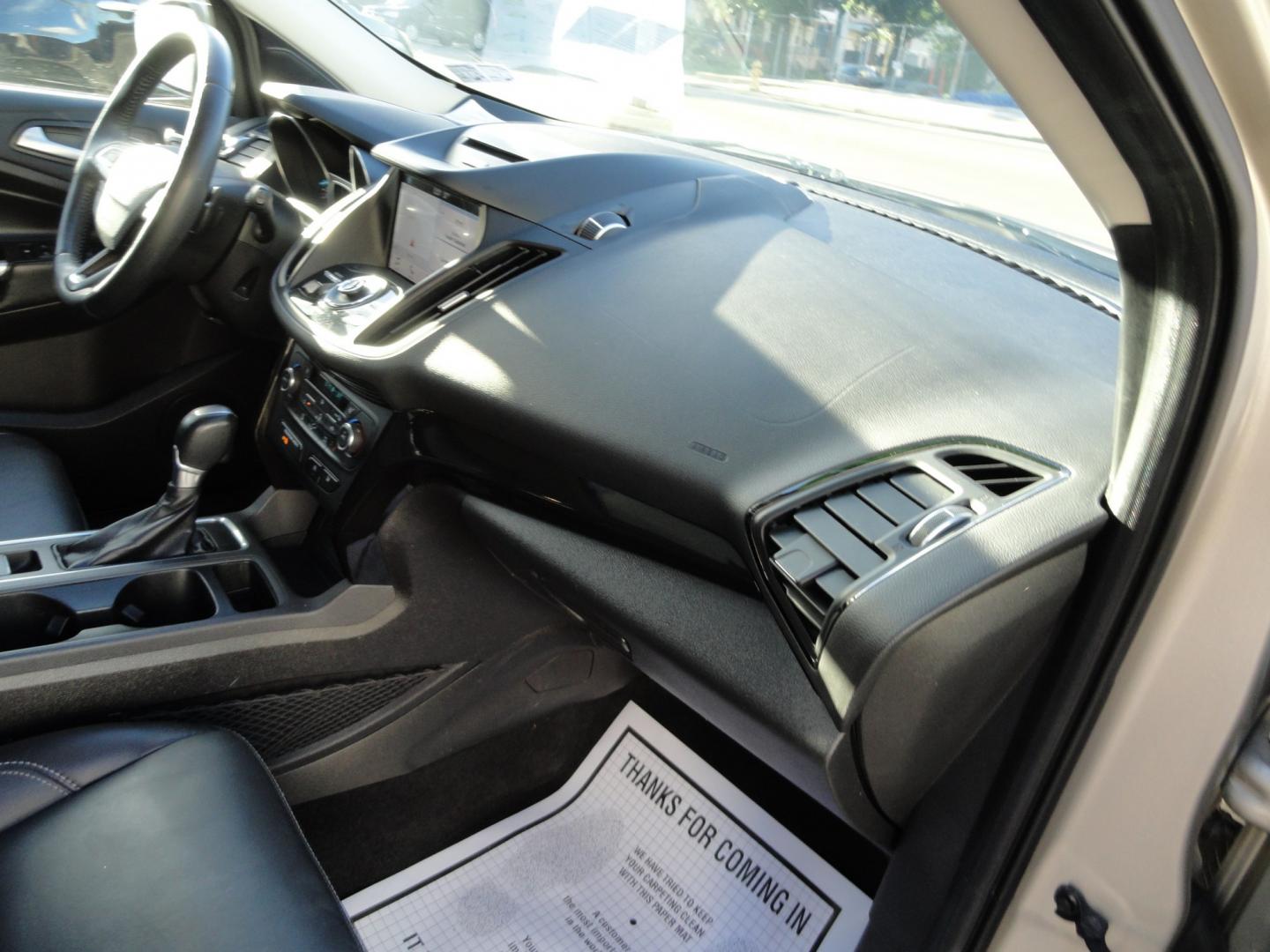2017 White Gold Metallic /Black Ford Escape Titanium 4WD (1FMCU9J97HU) with an 2.0L L4 DOHC 16V engine, 6-Speed Automatic transmission, located at 827 W 26th Street, Erie, PA, 16508, (814) 455-3401, 42.105431, -80.090942 - Thanks for looking at our extra clean accident and rust free two owner recent arrival. This is the top-of-the-line Titanium four-wheel drive model that's in like new condition with no paint or body damage and the nonsmoker interior is like new also, plus it comes with all the options available inclu- Photo#44