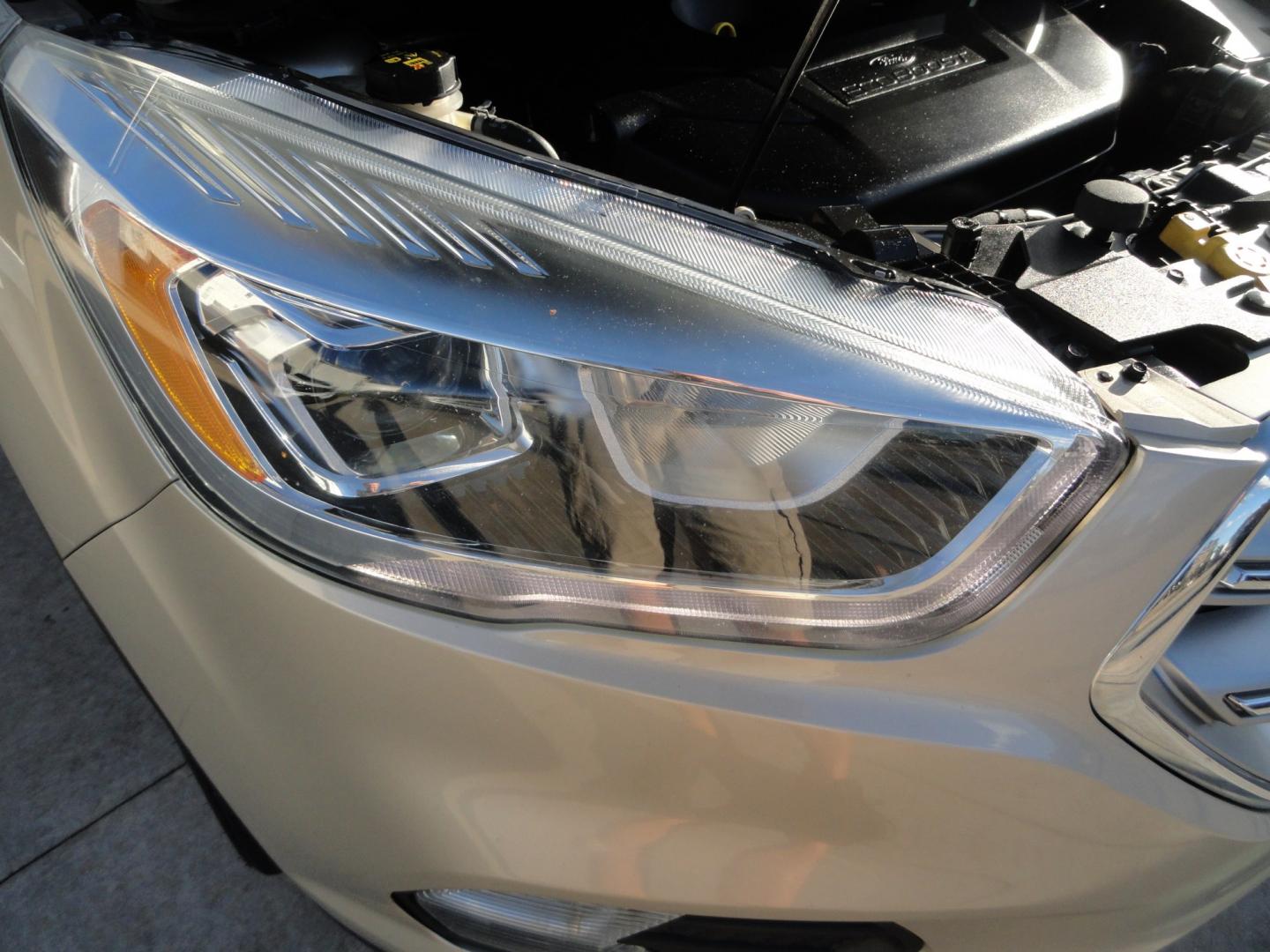 2017 White Gold Metallic /Black Ford Escape Titanium 4WD (1FMCU9J97HU) with an 2.0L L4 DOHC 16V engine, 6-Speed Automatic transmission, located at 827 W 26th Street, Erie, PA, 16508, (814) 455-3401, 42.105431, -80.090942 - Thanks for looking at our extra clean accident and rust free two owner recent arrival. This is the top-of-the-line Titanium four-wheel drive model that's in like new condition with no paint or body damage and the nonsmoker interior is like new also, plus it comes with all the options available inclu- Photo#50
