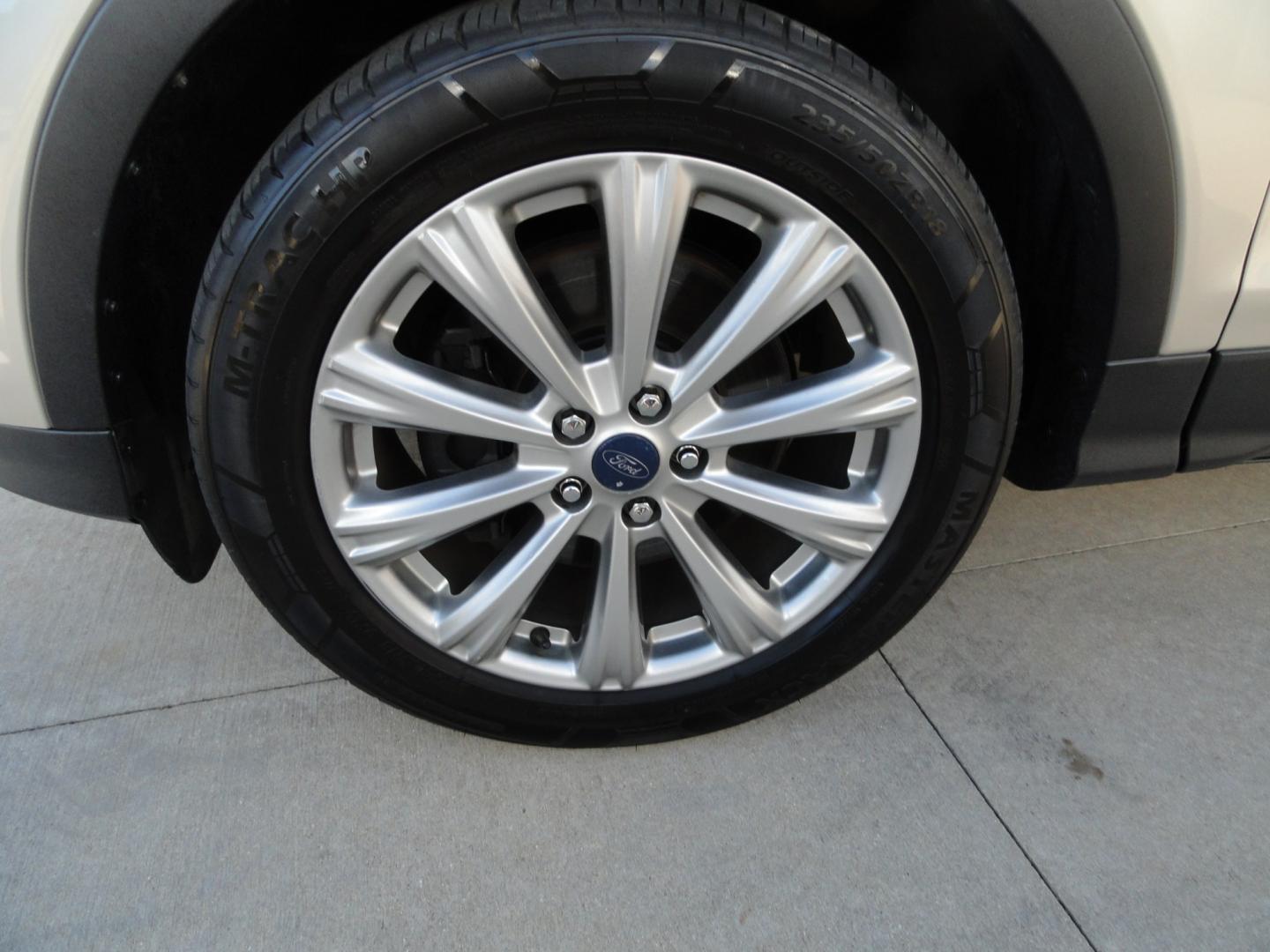2017 White Gold Metallic /Black Ford Escape Titanium 4WD (1FMCU9J97HU) with an 2.0L L4 DOHC 16V engine, 6-Speed Automatic transmission, located at 827 W 26th Street, Erie, PA, 16508, (814) 455-3401, 42.105431, -80.090942 - Thanks for looking at our extra clean accident and rust free two owner recent arrival. This is the top-of-the-line Titanium four-wheel drive model that's in like new condition with no paint or body damage and the nonsmoker interior is like new also, plus it comes with all the options available inclu- Photo#58