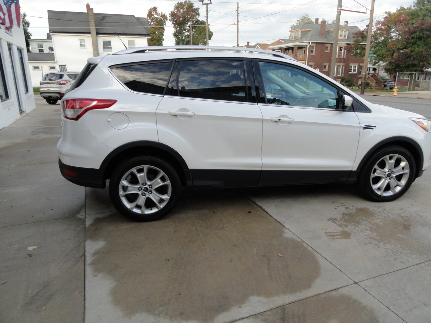 2016 White Platinum Metallic /Tan Ford Escape Titanium 4WD (1FMCU9J92GU) with an 2.0L L4 DOHC 16V engine, 6-Speed Automatic transmission, located at 827 W 26th Street, Erie, PA, 16508, (814) 455-3401, 42.105431, -80.090942 - Thanks for looking at our super clean two owner accident-free recent arrival. This is the Titanium model with four-wheel drive and pretty much has all the options that were available in the 2016 model year. A full service was just completed in our service department with new Pa state and emissions i- Photo#3