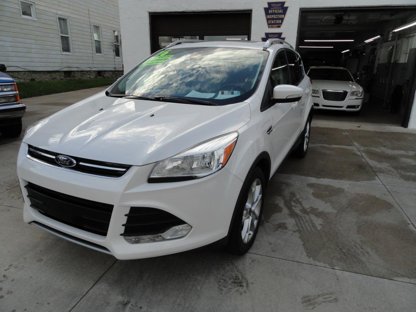 2016 White Platinum Metallic /Tan Ford Escape Titanium 4WD (1FMCU9J92GU) with an 2.0L L4 DOHC 16V engine, 6-Speed Automatic transmission, located at 827 W 26th Street, Erie, PA, 16508, (814) 455-3401, 42.105431, -80.090942 - Thanks for looking at our super clean two owner accident-free recent arrival. This is the Titanium model with four-wheel drive and pretty much has all the options that were available in the 2016 model year. A full service was just completed in our service department with new Pa state and emissions i- Photo#7