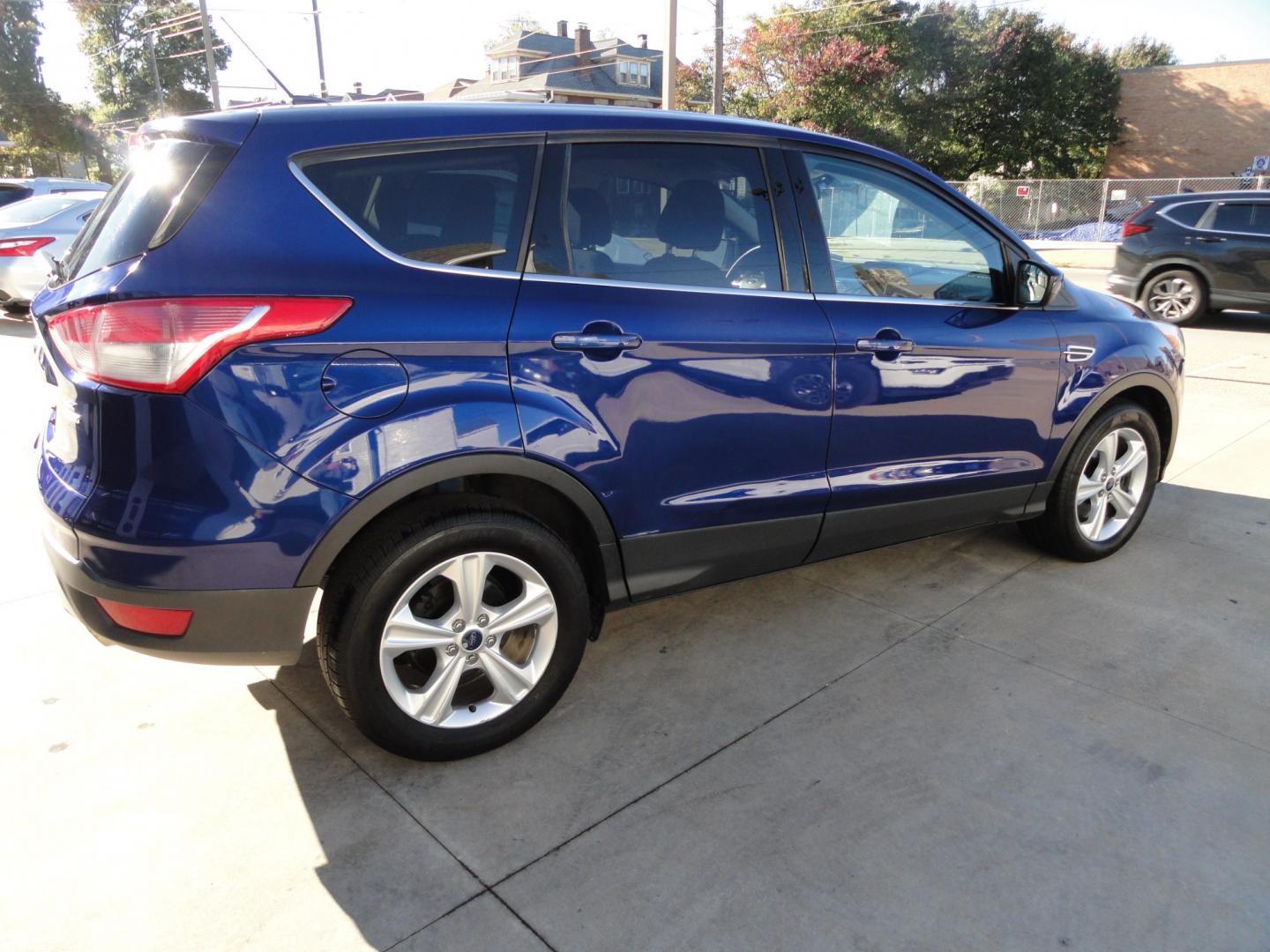 2015 Deep Impact Blue /Greystone Ford Escape SE 4WD (1FMCU9GX9FU) with an 1.6L L4 DOHC 16V engine, 6-Speed Automatic transmission, located at 827 W 26th Street, Erie, PA, 16508, (814) 455-3401, 42.105431, -80.090942- Photo#3